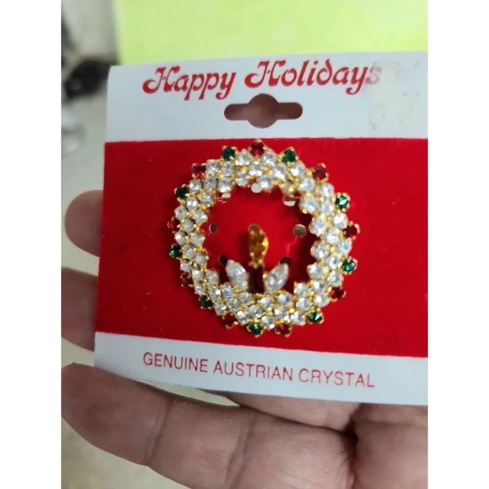 holiday wreath and candle with lots of crystals brooch